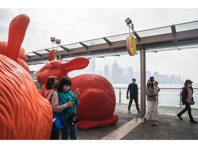 Sculptures displayed during Lunar New Year holidays in the Tsim Sha Tsui district of Hong Kong, China, on Monday, Jan. 23, 2023. Hong Kong has now abandoned virtually all its Covid restrictions with the exception of the mandatory wearing of masks. Anticipation is building over when the city will drop the mask mandate, a visual reminder of the pandemic era.
