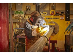A skilled tradesperson carries out welding activities at the Lloydminster Upgrader.
