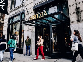 A shopper exits an Aritzia store in New York.