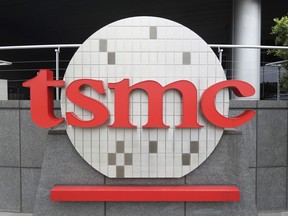 Taiwan Semiconductor Manufacturing Co., Ltd. (TSMC) logo brands the headquarters in Hsinchu, Taiwan, Wednesday, Oct. 20, 2021. TSMC, the biggest contract manufacturer of processor chips for smartphones and other products, said Thursday, Jan. 12, 2023, its quarterly profit rose 78% over a year earlier but forecast weak demand this year.