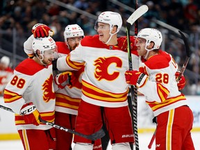 Calgary Flames players celebrate a goal in Seattle, in January.