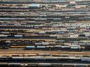 Freight trains and oil tankers sit in a rail yard in this aerial photograph taken above Toronto. Canada's trade balance swung into deficit in November, a sign, economists say, of weakening demand. 