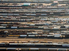 Freight trains and oil tankers sit in a rail yard in this aerial photograph taken above Toronto. Canada's trade balance swung into deficit in November, a sign, economists say, of weakening demand.