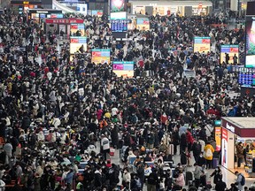 Passengers wait to board trains at Shanghai's Hongqiao Railway Station during the annual Spring Festival travel rush ahead of the Chinese Lunar New Year.