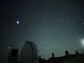 This image taken from video provided by the NAOJ & Asahi Shimbun, shows spiral swirling through the night sky from Mauna Kea, Hawaii's tallest mountain. Researchers believe it shows the after effects of a SpaceX rocket launch when the company's Falcon 9 rocket sent a GPS satellite into orbit. The images were captured on Jan. 18, 2023, by a camera at the summit of Mauna Kea outside the National Astronomical Observatory of Japan's Subaru telescope. (NAOJ & Asahi Shimbun via AP)