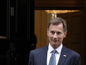 FILE - Britain's Chancellor Jeremy Hunt leaves 11 Downing Street to attend Parliament in London, Thursday, Nov. 17, 2022. Britain's Treasury chief said Friday, Jan. 27, 2023, that taming inflation is more important than cutting taxes, resisting calls from some in the governing Conservative Party for immediate tax breaks for businesses and voters.