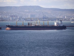 FILE - An oil tanker is moored at the Sheskharis complex, part of Chernomortransneft JSC, a subsidiary of Transneft PJSC, in Novorossiysk, Russia, on Oct. 11, 2022. A price cap and European Union embargo on most Russian oil have cut into Moscow's revenue from fossil fuels, but the Kremlin is still earning substantial cash to fund its war in Ukraine because the $60-per-barrel cap was "too lenient," researchers said Wednesday, Jan. 11, 2023. (AP Photo, File)