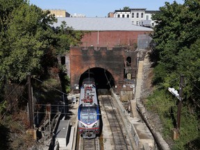 FILE - An Amtrak train emerges from the Baltimore and Potomac Tunnel in Baltimore, Sept. 15, 2015. The tunnel is finally slated to be replaced with help from the $1 trillion bipartisan infrastructure legislation championed by Biden, and he plans to visit on Monday to talk about the massive investment.