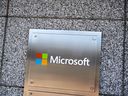 A sign outside a building with offices belonging to Microsoft is seen in Chevy Chase, Maryland, Jan.  18, 2023.