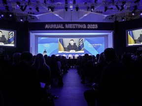 President Volodymyr Zelenskyy of Ukraine talks from a video screen to participants at the World Economic Forum in Davos, Switzerland on Wednesday, Jan. 18, 2023. The annual meeting of the World Economic Forum is taking place in Davos from Jan. 16 until Jan. 20, 2023.