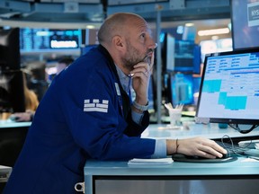 Traders work on the floor of the New York Stock Exchange.