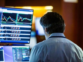 A trader works on the floor of the New York Stock Exchange.