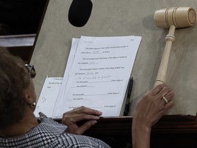 House Clerk Cheryl Johnson holds the Speaker's gavel alongside the vote tally after Republican Leader Kevin McCarthy (R-CA) is elected Speaker of the House in the House Chamber at the U.S. Capitol Building in Washington, DC.