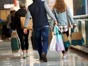 Shoppers carry bags of purchased merchandise at the King of Prussia Mall, United States' largest retail shopping space, in King of Prussia, Pennsylvania.