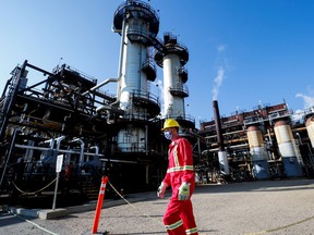 A Shell employee walks past the company's Quest Carbon Capture and Storage facility in Fort Saskatchewan, Alta.