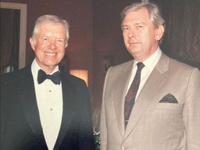 George Schwab, right, and former American president, Jimmy Carter.