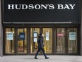 A pedestrian walks past Hudson's Bay on Toronto's Queen Street during the COVID-19 pandemic.