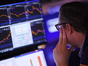 Traders work on the floor of the New York Stock Exchange.