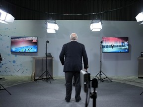 An attendee stands between cameras used to live broadcast into the metaverse during a Sony news conference before the start of the CES tech show Wednesday, Jan. 4, 2023, in Las Vegas.