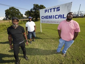 FILE - Richard Strong, left, his brother Gregory Strong, center, and Stacy Griffin pose for a photo on Sept. 9, 2021, in Indianola, Miss. They are among Black farmworkers in Mississippi who said in a lawsuit that their former employer, Pitts Farm Partnership, brought white laborers from South Africa to do the same jobs they were doing, and that the farm violated U.S. law by paying the white immigrants significantly more for the same type of work. The lawsuit and a similar one filed by other Black workers against a catfish farm in the Mississippi Delta were settled in December 2022. Terms of the settlements are private, but an attorney said the Black farmworkers will be compensated for the discrimination they suffered.