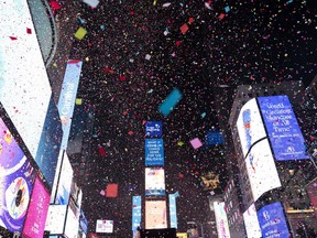 Confetti falls at midnight on the Times Square New Year's celebration, early Sunday, Jan. 1, 2023, in New York.