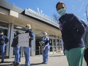 Nurses at Montefiore Medical Center Moses Division hold an "urgent community speak out" and press conference in front of the hospital, demanding N95s and other critical personal protective equipment to handle the COVID-19 outbreak, on April 2, 2020, in New York. Thousands of nurses in New York City notified eight hospitals, including Montefiore, on Friday, Dec. 30, 2022, that they will go on strike in 10 days unless contract agreements are reached.