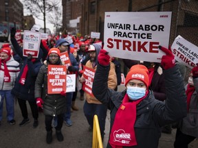 Protestors march on the streets around Montefiore Medical Center during a nursing strike, Wednesday, Jan. 11, 2023, in the Bronx borough of New York. A nursing strike that has disrupted patient care at two of New York City's largest hospitals has entered its third day.