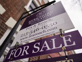 File - A for sale sign is posted on a home in Philadelphia, Wednesday, Jan. 4, 2023. On Thursday, Freddie Mac reports on this week's average U.S. mortgage rates.