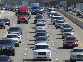 FILE - Drivers work their way out of Dallas during rush hour, July 1, 2016. The number of traffic deaths on U.S. roadways fell slightly during the first nine months of 2022, but pedestrian and cyclist deaths continue to rise.