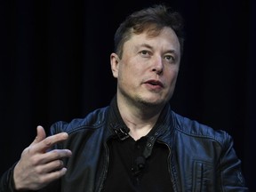 FILE - Tesla and SpaceX Chief Executive Officer Elon Musk speaks at the SATELLITE Conference and Exhibition on March 9, 2020, in Washington. Lawyers for Tesla shareholders suing Musk over a misleading tweet are urging a federal judge to reject the billionaire's request to move an upcoming trial to Texas from California.