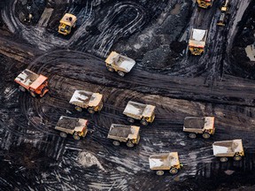 An aerial photograph shows the Athabasca oilsands near Fort McMurray, Alberta. While the upfront spending on a mine tends to be costlier than developing oil wells, their decades-long lifespans can make them lucrative in the future.