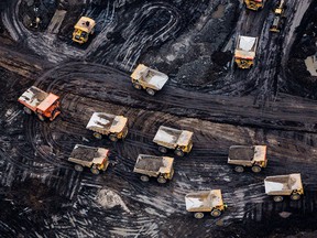 An aerial photograph shows the Athabasca oilsands near Fort McMurray, Alberta. While the upfront spending on a mine tends to be costlier than developing oil wells, their decades-long lifespans can make them lucrative in the future.