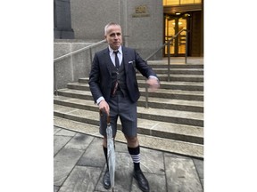 Fashion designer Thom Browne leaves Manhattan federal court, Thursday, Jan. 12, 2023, in New York, after a jury decided he did not infringe the trademark of sportswear giant Adidas.