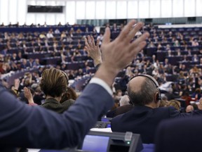 Members of the European Parliament vote on a new law to reform EU procedures and control measures for waste shipments at the European Parliament, Tuesday, Jan. 17, 2023 in Strasbourg, eastern France.