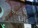 Signage is displayed inside the Sun Life Financial headquarters in Toronto. Photographer: Brent Lewin/Bloomberg