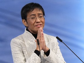 FILE - Nobel Peace Prize winner Maria Ressa of the Philippines gestures as she speaks during the Nobel Peace Prize ceremony at Oslo City Hall, Norway on Dec. 10, 2021. A Philippine tax court on Wednesday, Jan. 18, 2023 cleared Ressa and her online news company of tax evasion charges she said were part of a slew of legal cases used by former President Rodrigo Duterte to muzzle critical reporting.