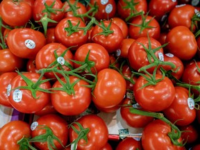 Tomatoes for sale at a grocery store.