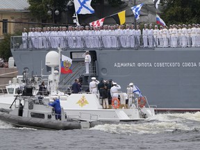 FILE - Russian President Vladimir Putin onboard a boat, greets sailors of the frigate named "Admiral of the Fleet of the Soviet Union Gorshkov" during Navy Day celebrations, in the Neva River in St. Petersburg, Russia, on July 31, 2022. Russian President Vladimir Putin on Wednesday Jan. 4, 2023 sent a frigate off to the Atlantic Ocean armed with hypersonic Zircon cruise missiles.