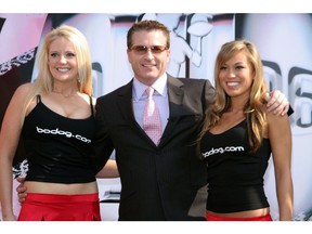 LOS ANGELES - JANUARY 30: Bodog CEO Calvin Ayre (C) poses during the Bodog.com Lingerie Bowl media day January 30, 2006 in Los Angeles, California.