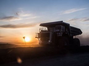 The sun sets over a dump truck operating at the Tavan Tolgoi coal deposit developed by Erdenes Tavan Tolgoi JSC, a unit of Erdenes Mongol LLC, during sunset in Tsogtsetsii, Ömnögovi Province, Mongolia, on Monday, Sept. 24, 2018. Mongolia has expanded its coal reserves by 24 percent at the state-owned giant Tavan Tolgoi mine to 6.34 billion tons, according to Erdenes Tavan Tolgoi Chief Executive Officer Gankhuyag Battulga. Mongolian lawmakers in June approved a plan to sell up to 30% of the coal mine in the Gobi desert, the latest attempt to develop what's anticipated to be massive coking and thermal coal deposit. Photographer: Taylor Weidman/Bloomberg