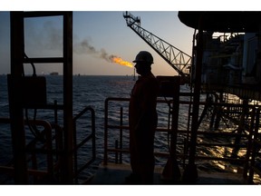 A gas flame burns from a pipe close to an offshore oil platform in the Persian Gulf's Salman Oil Field, operated by the National Iranian Offshore Oil Co., near Lavan island, Iran, on Thursday, Jan. 5. 2017. Nov. 5 is the day when sweeping U.S. sanctions on Iran's energy and banking sectors go back into effect after Trump's decision in May to walk away from the six-nation deal with Iran that suspended them. Photographer: Ali Mohammadi/Bloomberg