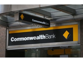 Signage for Commonwealth Bank of Australia is displayed outside a branch in Sydney, Australia, on Wednesday, Feb. 6, 2019. Commonwealth Bank of reported a slight increase in first-half profit as Chief Executive Officer Matt Comyn steadies the ship after the turmoil of a yearlong inquiry into financial industry misconduct. Photographer David Moir/Bloomberg Photographer: David Moir/Bloomberg