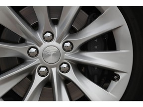 The Tesla Inc. logo sits on the wheel hub of a Tesla Model S electric automobile at the Nextmove headquarters in Leipzig, Germany, on Thursday, Aug. 15, 2019. In Europe, Tesla is racing against time as more established players wake up to the electric future. Photographer: Krisztian Bocsi/Bloomberg
