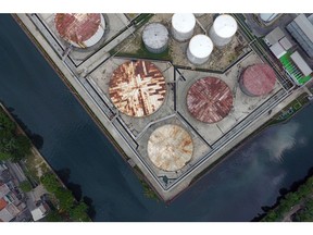 Fuel storage tanks stand at a PT Pertamina facility in this aerial photograph taken above Tanjung Priok Port in Jakarta, Indonesia on Tuesday, April 21, 2020.  Photographer: Dimas Ardian/Bloomberg