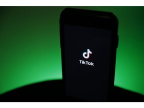 The TikTok logo is displayed on a smartphone in this arranged photograph in London, U.K., on Monday, Aug. 3, 2020. TikTok has become a flash point among rising U.S.-China tensions in recent months as U.S. politicians raised concerns that parent company ByteDance Ltd. could be compelled to hand over American users' data to Beijing or use the app to influence the 165 million Americans, and more than 2 billion users globally, who have downloaded it.