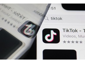 The download page for ByteDance Ltd.'s TikTok app is arranged for a photograph on a smartphone in Sydney, New South Wales, Australia, on Monday, Sept. 14, 2020. Oracle Corp. is the winning bidder for a deal with TikTok's U.S. operations, people familiar with the talks said, after main rival Microsoft Corp. announced its offer for the video app was rejected. Photographer: Brent Lewin/Bloomberg