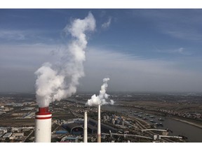 WUHAN, CHINA - NOVEMBER 11: (CHINA OUT) An aerial view of the coal fired power plant on November 11, 2021 in Hanchuan, Hubei province, China. China and the United States on Wednesday released the China-U.S. Joint Glasgow Declaration on Enhancing Climate Action in the 2020s here at the ongoing COP26 to the United Nations Framework Convention on Climate Change.his is the 26th "Conference of the Parties" and represents a gathering of all the countries signed on to the U.N. Framework Convention on Climate Change and the Paris Climate Agreement. The aim of this year's conference is to commit countries to net-zero carbon emissions by 2050.