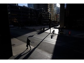 Commuters outside the TD Tower in the financial district of Toronto, Ontario, Canada, on Monday, Nov. 22, 2021. Many of Canada's large financial firms say they have a growing portion of their workforces back in the office and the numbers are expected to swell in the New Year. Photographer: Cole Burston/Bloomberg