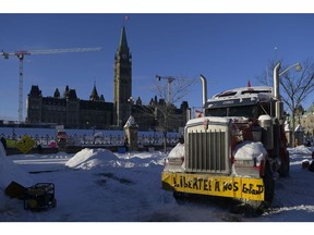 A truck sits abandoned outside Parliament in Ottawa on Feb. 18, 2022 after police began to clear out demonstrators that had gridlocked the downtown core for three weeks.