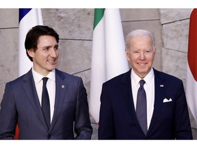 BRUSSELS, BELGIUM - MARCH 24: Canada's Prime Minister Justin Trudeau, U.S. President Joe Biden and Germany's Chancellor Olaf Scholz pose for a G7 leaders' family photo during a NATO summit on Russia's invasion of Ukraine, at the alliance's headquarters in Brussels, on March 24, 2022 in Brussels, Belgium. Heads of State and Government take part in the North Atlantic Council (NAC) Summit. They will discuss the consequences of President Putin's invasion of Ukraine and the role of China in the crisis. Then decide on the next steps to strengthen NATO's deterrence and defence.